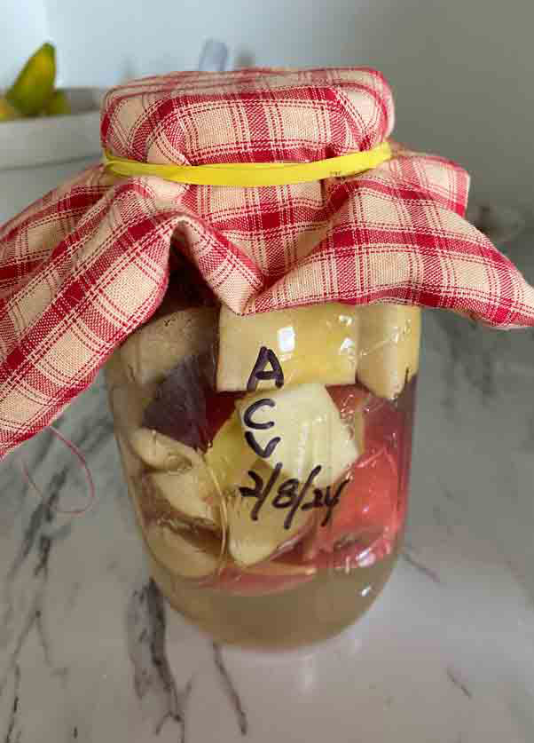 apples in jar with plaid cover