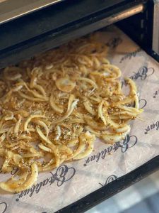 onions on a dehydrating tray