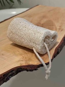 store bought loofah on wood on tub